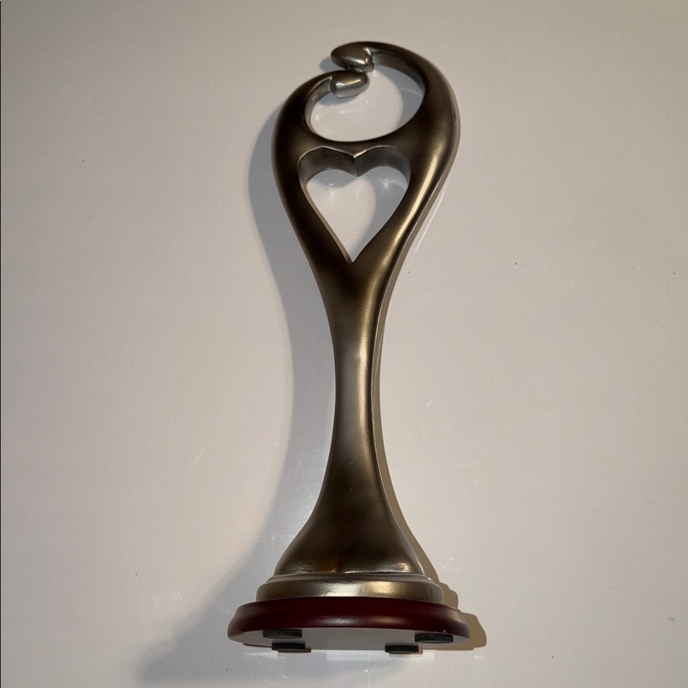 Elegant Silver Heart Sculpture on the Wooden Stand. 12”